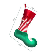 Load image into Gallery viewer, Holiday Elf Stocking by Allthingscurated are inspired by the signature curly-toed boots and striped tights that are worn by the little elves. The cute design is both fun and bright in traditional Christmas red and green. They are perfect for adding some jolly cheer to your holiday décor.