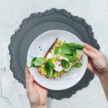 Load image into Gallery viewer, Embossed Lace Round Silicone Placemat by Allthingscurated are expertly crafted from high-quality, food-grade silicone. Available in 7 trendy colors with an embossed lace pattern, this placemat adds texture and charm to your dining table, making your meals more presentable effortlessly stylish.