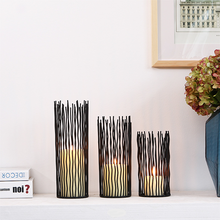 Load image into Gallery viewer, Estel Black Wire Candle Holders by Allthingscurated have openwork pattern that resembles willow-like branches in a cylindrical arrangement. Crafted from iron and in black finish, these candle holders come in 3 sizes.