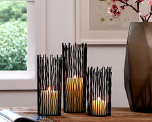 Load image into Gallery viewer, Estel Black Wire Candle Holders by Allthingscurated have openwork pattern that resembles willow-like branches in a cylindrical arrangement. Crafted from iron and in black finish, these candle holders come in 3 sizes.