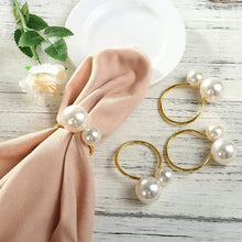 Load image into Gallery viewer, Faux Pearls Napkin Rings in a set of 6 by Allthingscurated are adorned with big and small pearls to create an overall look of elegance and sophistication. They are perfect for special occasions. Come available in 4 different color combinations.