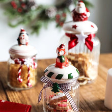 Load image into Gallery viewer, Christmas Festive Storage Jars by Allthingscurated are the perfect jars to keep all your festive treats fresh and delicious. The jars are airtight and each jar is topped with a ceramic lid decorated with a Santa Claus, Christmas Tree, Penguin, Gnome or Fox. Comes in 2 sizes with capacity of 300ml or 10 ounce and 1000ml or 34 ounce.