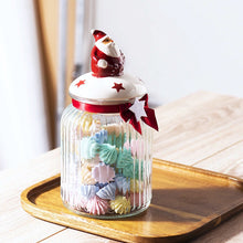 Load image into Gallery viewer, Christmas Festive Storage Jars by Allthingscurated are the perfect jars to keep all your festive treats fresh and delicious. The jars are airtight and each jar is topped with a ceramic lid decorated with a Santa Claus, Christmas Tree, Penguin, Gnome or Fox. Comes in 2 sizes with capacity of 300ml or 10 ounce and 1000ml or 34 ounce.