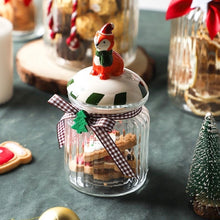 Load image into Gallery viewer, Christmas Festive Storage Jars by Allthingscurated are the perfect jars to keep all your festive treats fresh and delicious. The jars are airtight and each jar is topped with a ceramic lid decorated with a Santa Claus, Christmas Tree, Penguin, Gnome or Fox. Comes in 2 sizes with capacity of 300ml or 10 ounce and 1000ml or 34 ounce.