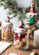Load image into Gallery viewer, Christmas Festive Storage Jars by Allthingscurated are the perfect jars to keep all your festive treats fresh and delicious. The jars are airtight and each jar is topped with a ceramic lid decorated with a Santa Claus, Christmas Tree, Penguin, Gnome or Fox. Comes in 2 sizes with capacity of 300ml or 10 ounce and 1000ml or 34 ounce.