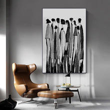 Load image into Gallery viewer, Modern Abstract Figure Art Canvas Print by Allthingscurated featured abstract human silhouettes in black and white is well suited for a contemporary and modern home with a minimalist vibe.