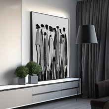 Load image into Gallery viewer, Modern Abstract Figure Art Canvas Print by Allthingscurated featured abstract human silhouettes in black and white is well suited for a contemporary and modern home with a minimalist vibe.