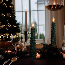 Load image into Gallery viewer, Flameless Christmas Tree LED Candles by Allthingscurated are crafted from paraffin wax to mimic real candles. Battery-operated with a remote control provided, these taper candles light up your holiday season with the flickering warm glow from the LED bulb without the fire hazard. Comes in a set of 4.