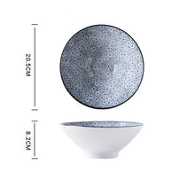 Load image into Gallery viewer, This Blue and White Japanese Ramen Bowls by Allthingscurated feature a modern, Asian design in a conical shape with a white fluted exterior, the porcelain bowls spot a beautiful, Japanese-inspired print for the interior. Comes in 4 different designs, this versatile bowl is not just for ramen, but also great for soups, curries and salads. Seen here is the Floral design.