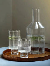 Load image into Gallery viewer, Florentina Drinkware by Allthingscurated embraces a modern design featuring sleek fluted lines with a unique shape reminiscent of a peach blossom flower. Stylish and chic, this collection includes a carafe, goblets and several tumblers, including a glamorous coupe cocktail glass. Add elegance to everyday use with this beautiful collection and just as perfect for setting an extravagant holiday table.