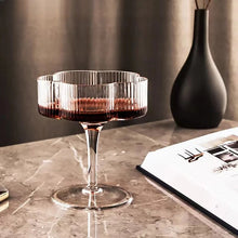 Load image into Gallery viewer, Florentina Drinkware by Allthingscurated embraces a modern design featuring sleek fluted lines with a unique shape reminiscent of a peach blossom flower. Stylish and chic, this collection includes a carafe, goblets and several tumblers, including a glamorous coupe cocktail glass. Add elegance to everyday use with this beautiful collection and just as perfect for setting an extravagant holiday table.