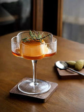 Load image into Gallery viewer, Florentina Drinkware by Allthingscurated embraces a modern design featuring sleek fluted lines with a unique shape reminiscent of a peach blossom flower. Stylish and chic, this collection includes a carafe, goblets and several tumblers, including a glamorous coupe cocktail glass. Add elegance to everyday use with this beautiful collection and just as perfect for setting an extravagant holiday table.