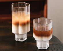 Load image into Gallery viewer, Florentina Drinkware by Allthingscurated embraces a modern design featuring sleek fluted lines with a unique shape reminiscent of a peach blossom flower. Stylish and chic, this collection includes a carafe, goblets and several tumblers, including a glamorous coupe cocktail glass. Add elegance to everyday use with this beautiful collection and just as perfect for setting an extravagant holiday table.