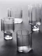 Load image into Gallery viewer, Florentina Drinkware by Allthingscurated embraces a modern design featuring sleek fluted lines with a unique shape reminiscent of a peach blossom flower. Stylish and chic, this collection includes a carafe, goblets and several tumblers, including a glamorous coupe cocktail glass. Add elegance to everyday use with this beautiful collection and just as perfect for setting an extravagant holiday table.