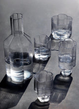 Load image into Gallery viewer, Florentina Drinkware by Allthingscurated embraces a modern design featuring sleek fluted lines with a unique shape reminiscent of a peach blossom flower. Stylish and chic, this collection includes a carafe, goblets and several tumblers, including a glamorous coupe cocktail glass. Add elegance to everyday use with this beautiful collection and just as perfect for setting an extravagant holiday table.