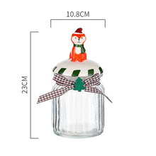 Load image into Gallery viewer, Christmas Festive Storage Jars by Allthingscurated are the perfect jars to keep all your festive treats fresh and delicious. The jars are airtight and each jar is topped with a ceramic lid decorated with a Santa Claus, Christmas Tree, Penguin, Gnome or Fox. Comes in 2 sizes with capacity of 300ml or 10 ounce and 1000ml or 34 ounce. Featured here is a large Fox jar.