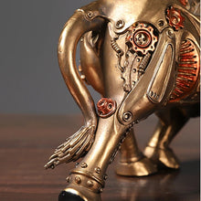 Load image into Gallery viewer, Futurox bull sculpture by Allthingscurated is the embodiment of steampunk aesthetics and futuristic mechanics. This exquisite masterpiece combines the grace and strength of a bull with the intricate beauty of gears. Standing at a height of 13.5cm or 5.3 inches, with length of 22.5cm or 8.8 inches and depth of 10.5cm or 4.1 inches. Its captivating presence will effortlessly elevate any space. Comes in gold and silver.