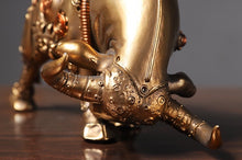 Load image into Gallery viewer, Futurox bull sculpture by Allthingscurated is the embodiment of steampunk aesthetics and futuristic mechanics. This exquisite masterpiece combines the grace and strength of a bull with the intricate beauty of gears. Standing at a height of 13.5cm or 5.3 inches, with length of 22.5cm or 8.8 inches and depth of 10.5cm or 4.1 inches. Its captivating presence will effortlessly elevate any space. Comes in gold and silver.
