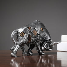Load image into Gallery viewer, Futurox bull sculpture by Allthingscurated is the embodiment of steampunk aesthetics and futuristic mechanics. This exquisite masterpiece combines the grace and strength of a bull with the intricate beauty of gears. Standing at a height of 13.5cm or 5.3 inches, with length of 22.5cm or 8.8 inches and depth of 10.5cm or 4.1 inches. Its captivating presence will effortlessly elevate any space. Comes in gold and silver.