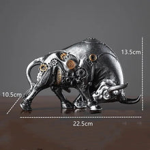 Load image into Gallery viewer, Futurox bull sculpture by Allthingscurated is the embodiment of steampunk aesthetics and futuristic mechanics. This exquisite masterpiece combines the grace and strength of a bull with the intricate beauty of gears. Standing at a height of 13.5cm or 5.3 inches, with length of 22.5cm or 8.8 inches and depth of 10.5cm or 4.1 inches. Its captivating presence will effortlessly elevate any space. Comes in gold and silver. Featured here is the sculpture in Silver.