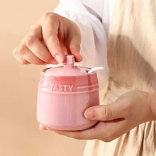 Load image into Gallery viewer, Gradient Colored Seasonings Jar by Allthingscurated come equipped with spoons for convenient access to their contents during cooking and dining. Made from high-quality porcelain, their vibrant colors in gradient tones and stylish design will add a pop of color to your kitchen or dining table, while keeping your herbs, spices and seasonings neatly stored and organized. 8 tasty colors to choose from.