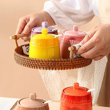 Load image into Gallery viewer, Gradient Colored Seasonings Jar by Allthingscurated come equipped with spoons for convenient access to their contents during cooking and dining. Made from high-quality porcelain, their vibrant colors in gradient tones and stylish design will add a pop of color to your kitchen or dining table, while keeping your herbs, spices and seasonings neatly stored and organized. 8 tasty colors to choose from.