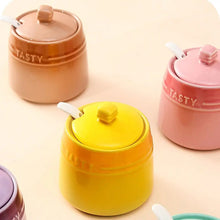 Load image into Gallery viewer, Gradient Colored Seasonings Jar by Allthingscurated come equipped with spoons for convenient access to their contents during cooking and dining. Made from high-quality porcelain, their vibrant colors in gradient tones and stylish design will add a pop of color to your kitchen or dining table, while keeping your herbs, spices and seasonings neatly stored and organized. 8 tasty colors to choose from.