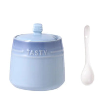 Load image into Gallery viewer, Gradient Colored Seasonings Jar by Allthingscurated come equipped with spoons for convenient access to their contents during cooking and dining. Made from high-quality porcelain, their vibrant colors in gradient tones and stylish design will add a pop of color to your kitchen or dining table, while keeping your herbs, spices and seasonings neatly stored and organized. 8 tasty colors to choose from. Featured here is jar in blue.