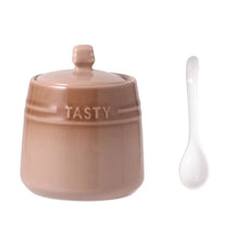 Load image into Gallery viewer, Gradient Colored Seasonings Jar by Allthingscurated come equipped with spoons for convenient access to their contents during cooking and dining. Made from high-quality porcelain, their vibrant colors in gradient tones and stylish design will add a pop of color to your kitchen or dining table, while keeping your herbs, spices and seasonings neatly stored and organized. 8 tasty colors to choose from. Featured here is jar in brown.