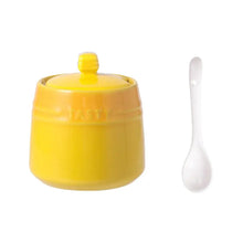 Load image into Gallery viewer, Gradient Colored Seasonings Jar by Allthingscurated come equipped with spoons for convenient access to their contents during cooking and dining. Made from high-quality porcelain, their vibrant colors in gradient tones and stylish design will add a pop of color to your kitchen or dining table, while keeping your herbs, spices and seasonings neatly stored and organized. 8 tasty colors to choose from. Featured here is jar in yellow.