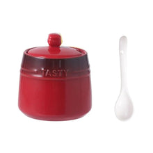 Load image into Gallery viewer, Gradient Colored Seasonings Jar by Allthingscurated come equipped with spoons for convenient access to their contents during cooking and dining. Made from high-quality porcelain, their vibrant colors in gradient tones and stylish design will add a pop of color to your kitchen or dining table, while keeping your herbs, spices and seasonings neatly stored and organized. 8 tasty colors to choose from. Featured here is jar in red.