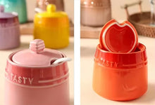 Load image into Gallery viewer, Gradient Colored Seasonings Jar by Allthingscurated come equipped with spoons for convenient access to their contents during cooking and dining. Made from high-quality porcelain, their vibrant colors in gradient tones and stylish design will add a pop of color to your kitchen or dining table, while keeping your herbs, spices and seasonings neatly stored and organized. 8 tasty colors to choose from.