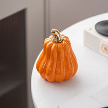 Load image into Gallery viewer, Glazed Ceramic Pumpkins by Allthingscurated spot a sculptural design that are perfect for adding a chic and stylish touch to your Halloween and Thanksgiving celebrations. Available in two designs in orange or white, let these ornamental pumpkins transform your home into a cozy autumn oasis.
