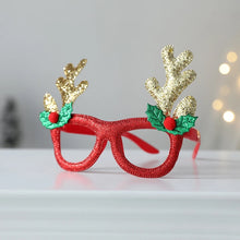 Load image into Gallery viewer, Antler Christmas Party Glasses by Allthingscurated are the perfect fun accessory for festive parties and gatherings during the holiday season. Their unique design and cheerful holiday style make them great props for creating memorable moments an happy Instagram posts to capture the joy of the season. Featured here is the Gold Antler design.