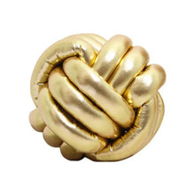 Load image into Gallery viewer, Metallic Color Knot Ball Cushions by Allthingscurated come in a metallic palette of Gold, Silver and Red. These cushions will give your home a trendy update easily with their bold design and bring attention to your favorite sofa or chair. Their unique spherical shape and eye-catching colors will add a stylish and sculptural touch to your living space. Featured here is the ball cushion in gold.