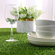 Load image into Gallery viewer, Faux Grass Table Runner by Allthingscurated is the perfect decorative piece to spice up your table settings for spring, summer and easter.  Featuring tufted grass for a realistic look, this runner is a must-have for garden-themed gatherings or outdoor parties. You can also decorate your patio and balcony with this fun and versatile decorative piece for a touch of nature indoor. Comes in 3 different sizes.