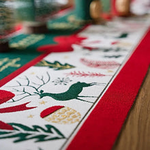 Load image into Gallery viewer, Holiday Bow and Elk Table Runners by Allthingscurated are inspired by all the notable symbols of Christmas like the merry bow, Christmas tree, elk and snowflakes. The jacquard table runners come in vibrant hues of blue and green with beautiful embroidery and complete with pretty tassels. Available in 9 sizes. They are perfect holiday decoration to bring a festive touch to. Your table setting.