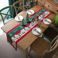 Load image into Gallery viewer, Holiday Bow and Elk Table Runners by Allthingscurated are inspired by all the notable symbols of Christmas like the merry bow, Christmas tree, elk and snowflakes. The jacquard table runners come in vibrant hues of blue and green with beautiful embroidery and complete with pretty tassels. Available in 9 sizes. They are perfect holiday decoration to bring a festive touch to. Your table setting.