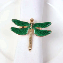 Load image into Gallery viewer, Dragonfly Napkin Rings by Allthingscurated come as a set of 6 rings in either classic gold or perennial green design. These dragon-shaped rings featured vivid venation patterns on their wings, adding a touch of natural beauty to any botanical-themed setting. Perfect for elevating your Summer tablescape. Featured here is the green design.