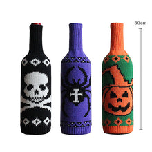 Load image into Gallery viewer, Halloween Knitted Wine Bottle Sleeves by Allthingscurated come in 3 trendy design of a skull, spider and pumpkin. They are are great way to dress up your wine bottles for quick Halloween makeover for your home and dining table.