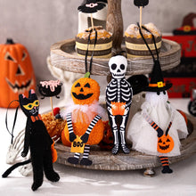 Load image into Gallery viewer, Halloween-themed decorations including a skeleton, black cat, and pumpkin on a tiered stand. These adorable Halloween Decorative Hangings Dolls by Allthingscurated spark joy and give your Holiday decor a fun and eerie vibe.