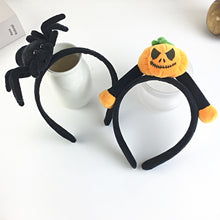 Load image into Gallery viewer, Featuring 3 cute designs, Plush Halloween Headbands by Allthingscurated blend comfort with style. They add a charming touch to your costume and create joyful photo moments to capture the festive spirit.
Seen here two Halloween-themed headbands with a spider and pumpkin design on a white background.