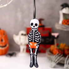 Load image into Gallery viewer, Hanging skeleton decoration with pumpkins and ghosts in the background. These adorable Halloween Decorative Hangings Dolls by Allthingscurated spark joy and give your Holiday decor a fun and eerie vibe.