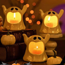 Load image into Gallery viewer, Happy Ghost Candle Holder by Allthingscurated is made from high-quality porcelain with a cute ghost design. Perfect for holding tealight candles. Group several holders together to create a cozy and fun atmosphere during Halloween.