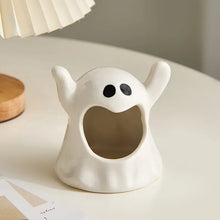 Load image into Gallery viewer, Happy Ghost Candle Holder by Allthingscurated is made from high-quality porcelain with a cute ghost design. Perfect for holding tealight candles. Group several holders together to create a cozy and fun atmosphere during Halloween.
