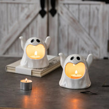 Load image into Gallery viewer, Happy Ghost Candle Holder by Allthingscurated is made from high-quality porcelain with a cute ghost design. Perfect for holding tealight candles. Group several holders together to create a cozy and fun atmosphere during Halloween.