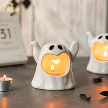 Load image into Gallery viewer, Happy Ghost Candle Holder by Allthingscurated is made from high-quality porcelain with a cute ghost design. Perfect for holding tealight candles. Group several holders together to create a cozy and fun atmosphere during Halloween.