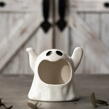 Load image into Gallery viewer, Happy Ghost Candle Holder by Allthingscurated is made from high-quality porcelain with a cute ghost design. Perfect for holding tealight candles. Group several holders together to create a cozy and fun atmosphere during Halloween.