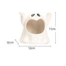 Load image into Gallery viewer, Happy Ghost Candle Holder by Allthingscurated is made from high-quality porcelain with a cute ghost design. Perfect for holding tealight candles. Group several holders together to create a cozy and fun atmosphere during Halloween.