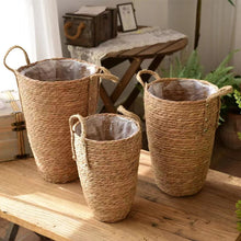 Load image into Gallery viewer, Hayden Tall Planters by Allthingscurated come in 3 sizes. Hand-woven using natural seagrass and comes with handles for easy transportation.